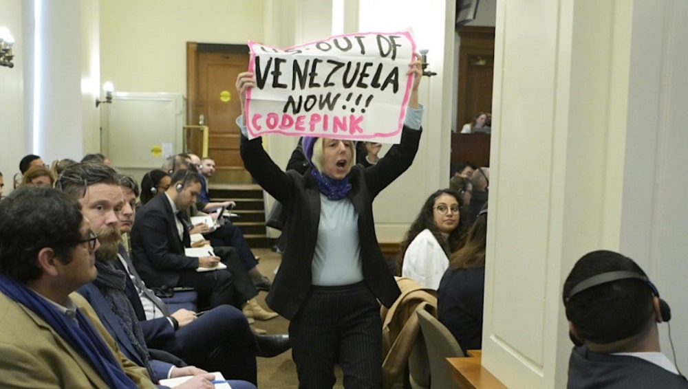 activista irrumpe en la OEA y protesta por la captura de Maduro-min